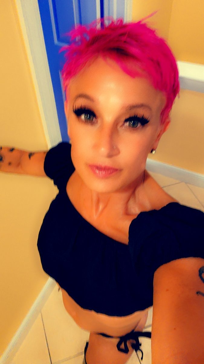 Madame D with pink hair