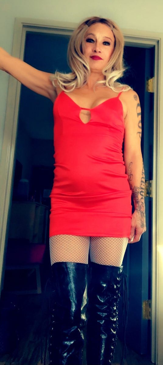 Madame D in red with boots