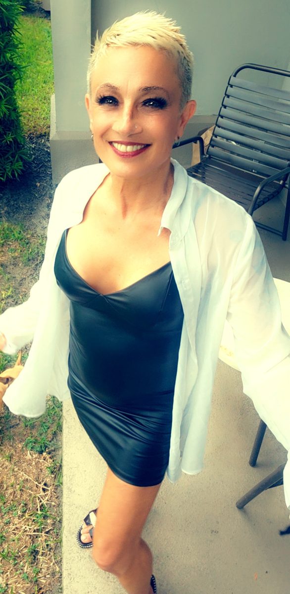 Madame D in a white shirt